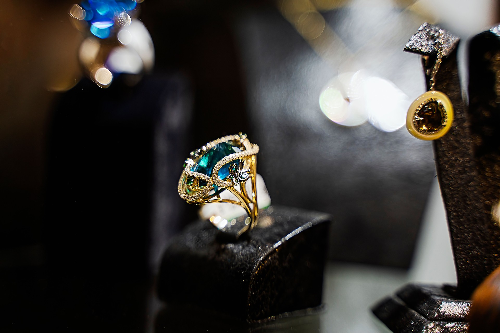 Gold jewelry diamond shop with rings and necklaces luxury retail store window display showcase